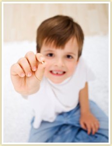 Kid showing his first tooth