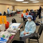 Dr. Vakili volunteering to administer the COVID vaccine